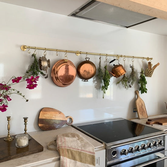 How a Copper Pot Rack Instantly Elevates Your Kitchen Design